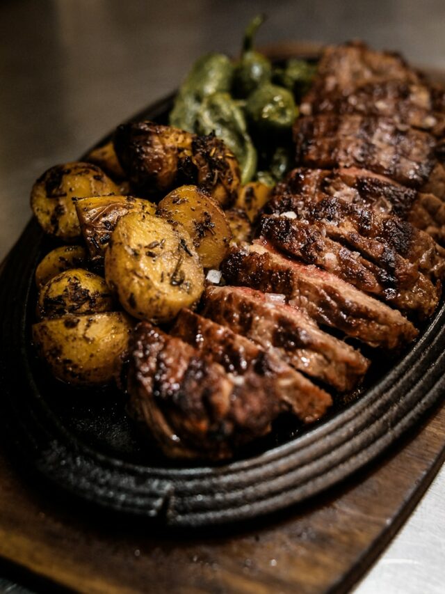 grilled meat on black ceramic plate
